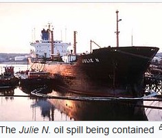 Oil tanker Julie N. crashes into the Million Dollar Bridge in Portland, Maine, spilling thousands of gallons of oil into the Fore River