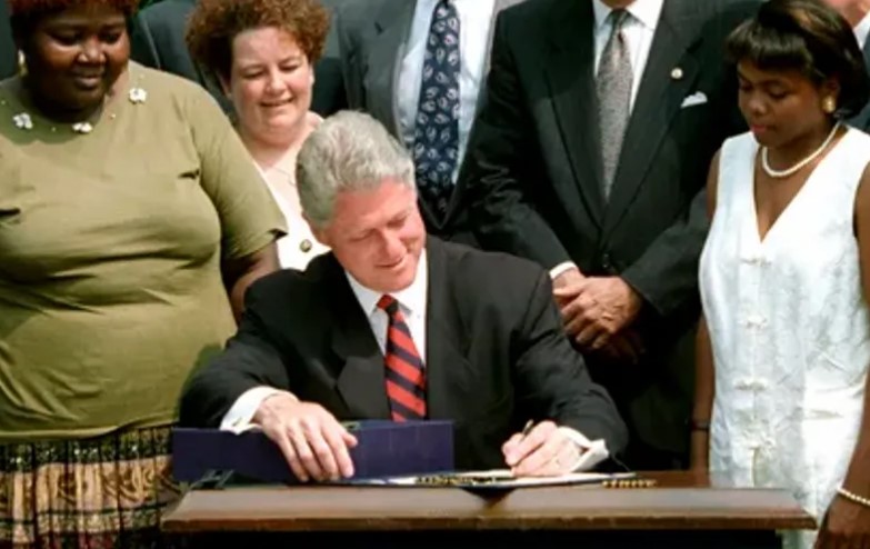 President Bill Clinton signs the Personal Responsibility and Work Opportunity Reconciliation Act